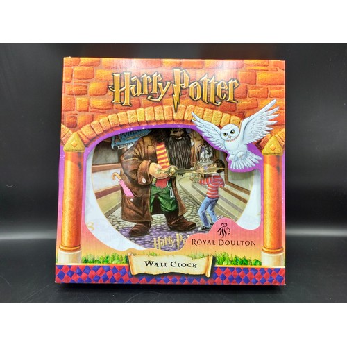 78a - Boxed Royal doulton Harry potter wall clock . 10 inches in length in box .