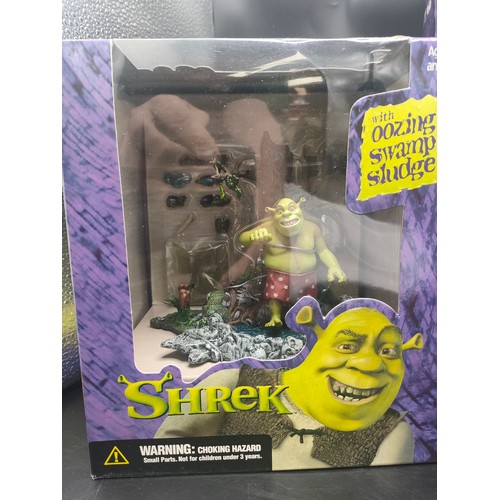 124 - 3 boxed Shrek figures produced by McFarlane. [Will not post]