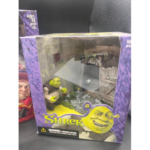 124 - 3 boxed Shrek figures produced by McFarlane. [Will not post]