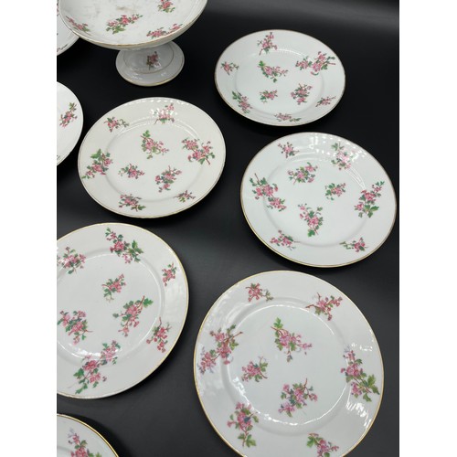 175 - A set of twelve 19th century English tea plates and tazza. Showing a pink flower design. [Some as fo... 