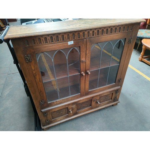 173 - Old charm style two door cabinet with fitted under storage.