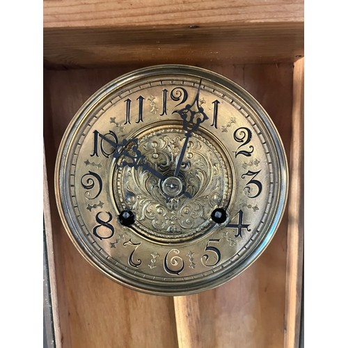 589 - Antique light wood wall clock, Brass ornate face and pendulum. Marked 'B' To brass work. Double drum... 