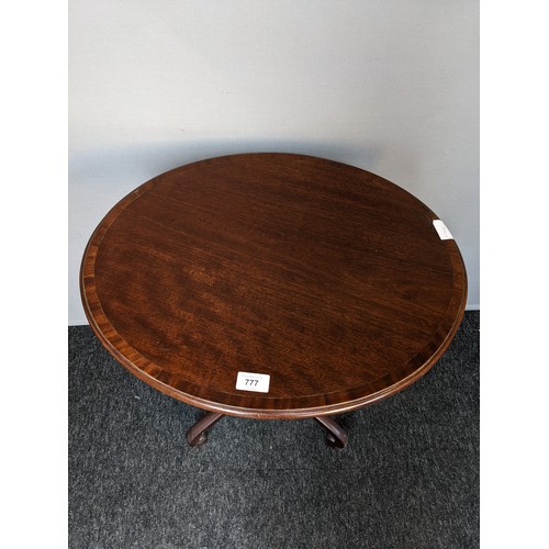 777 - Georgian style mahogany side table, the oval top with banding, raised on outswept legs ending in car... 