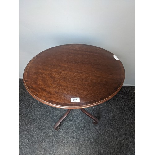 777 - Georgian style mahogany side table, the oval top with banding, raised on outswept legs ending in car... 