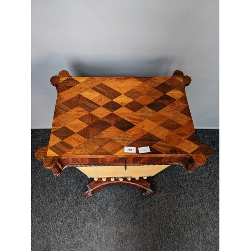 782 - 19th century sewing table, the shaped rectangular top with parquetry, above two pull-out drawers lea... 