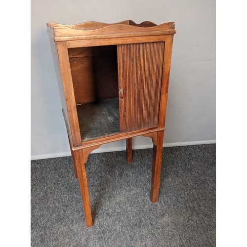 792 - 19th century bedside cabinet, the square top with wavy gallery, above tambour door opening to interi... 