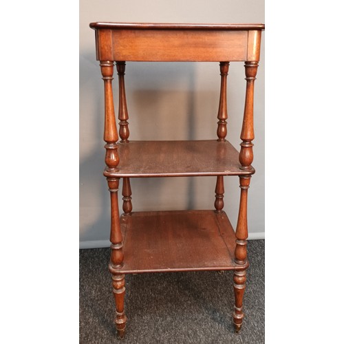 751 - Antique mahogany three tier stand, raised on turned legs ending in brass castor feet [76x35cm]