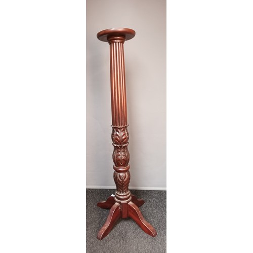 758 - Antique style torcher stand, circular top above a Corinthian column ending in carved foliage, raised... 