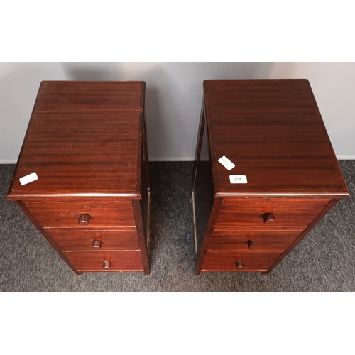 754 - Pair of stained pine units, the rectangular top above a bank of three drawers [69x30.5x38cm]