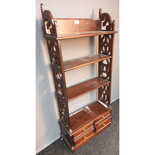 804 - Antique style mahogany unit, four open shelves flanked by pierced and carved sides, above four short... 