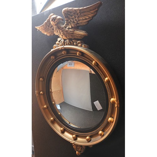 813 - Antique style circular concave mirror surmounted by eagle