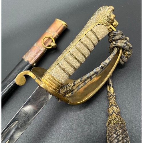 618 - Antique R.N.V. Officers sword. Engraved to blade, comes with scabbard. Also fitted with a sword knot... 