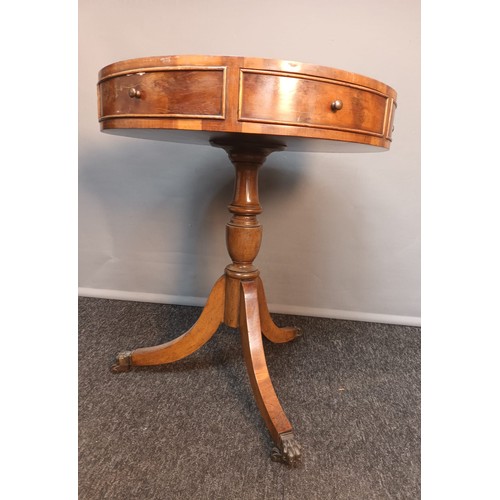 807 - 19th century circular table, the top with leather surface above band of drawers with some opening an... 