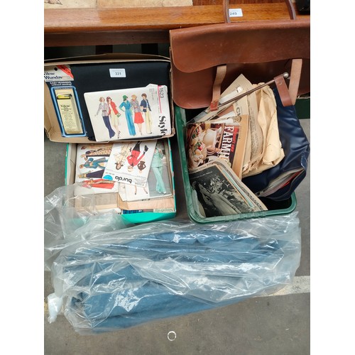 331 - Box of various sewing patterns , box of miscellaneous together with role of material.