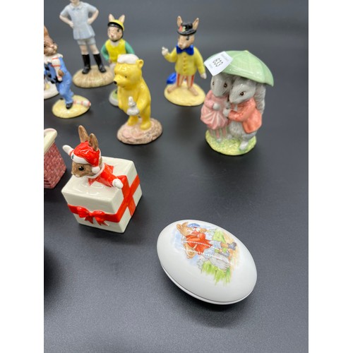 633 - A Collection of Royal Doulton and Royal Albert figures, Includes Winnie the Pooh, Beatrix potter and... 