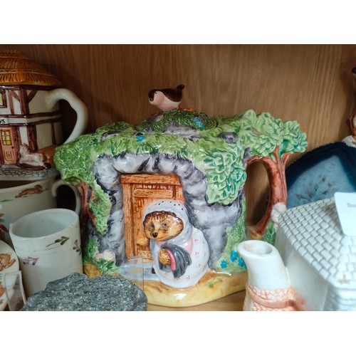 300 - Shelf of collectables to include collectable Beatrix Potter tea pot etc .