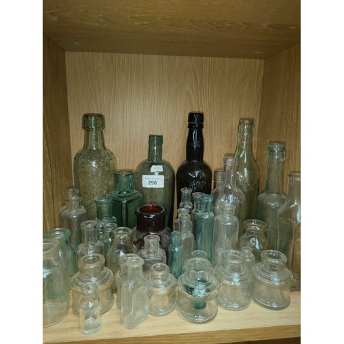 296 - Collection of antique bottles and ink glass ink pots.