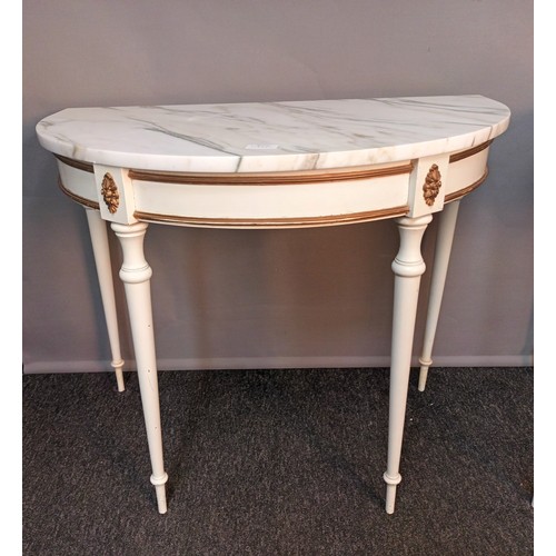 824 - Two French style demi lune table, the marble top raised by turned tapered legs, together with a corn... 