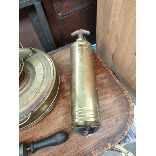 291 - Selection of antique brass ware includes oil lamp , brass fire extinguisher etc .