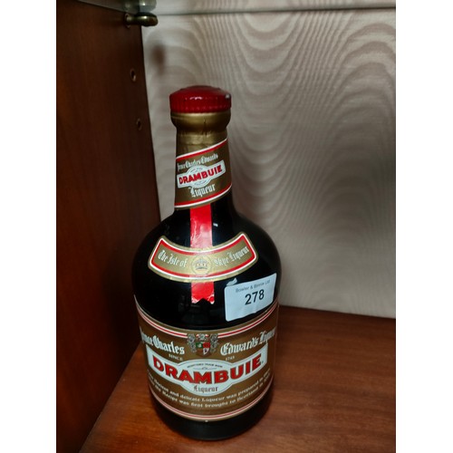 278 - 1 litre Bottle of Drambuie full and sealed .