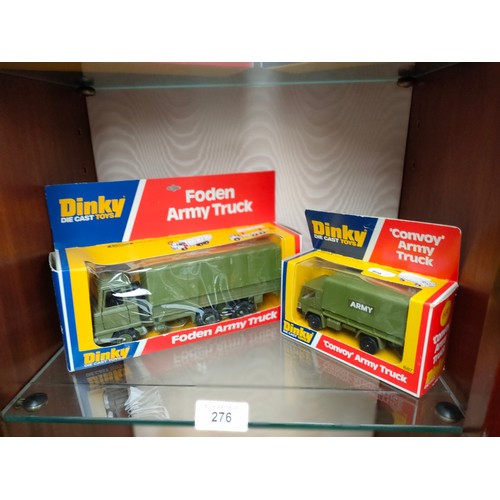 276 - 2 Boxed Dinky army vehicles includes folden army truck .