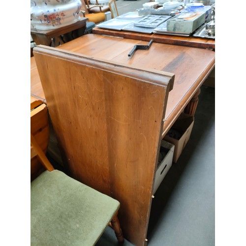 267 - Antique wind out table with key and spare leaf .