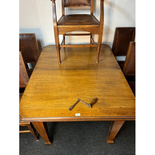 849 - Wylie & Lochhead Glasgow extending wind out dining table, carver and four matching chairs. Comes wit... 