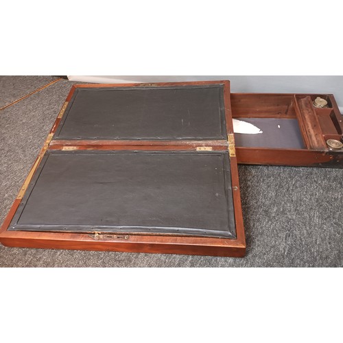 566 - Antique mahogany travel writing slope. With pull out side drawer containing inkwell pot.