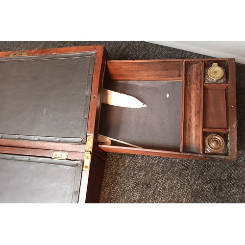 566 - Antique mahogany travel writing slope. With pull out side drawer containing inkwell pot.