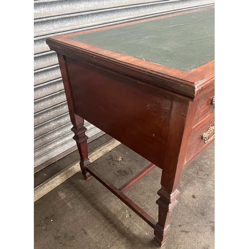 832 - Antique mahogany desk, the rectangular top with a green surface area above a centre drawer flanked b... 