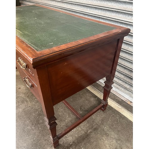 832 - Antique mahogany desk, the rectangular top with a green surface area above a centre drawer flanked b... 