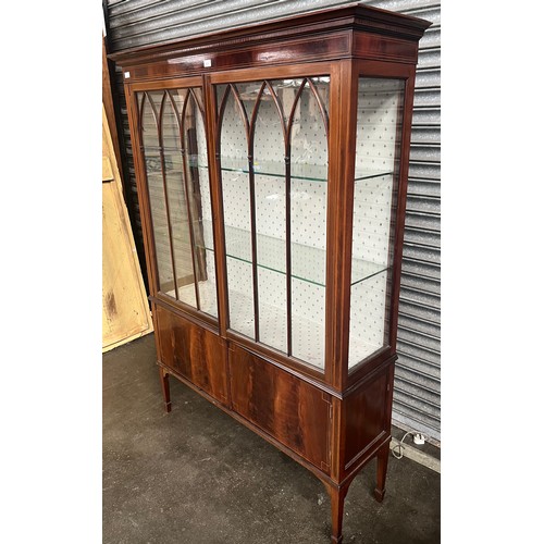 838 - Antique mahogany display cabinet, the moulded cornice above two moulded paneled doors leading to int... 