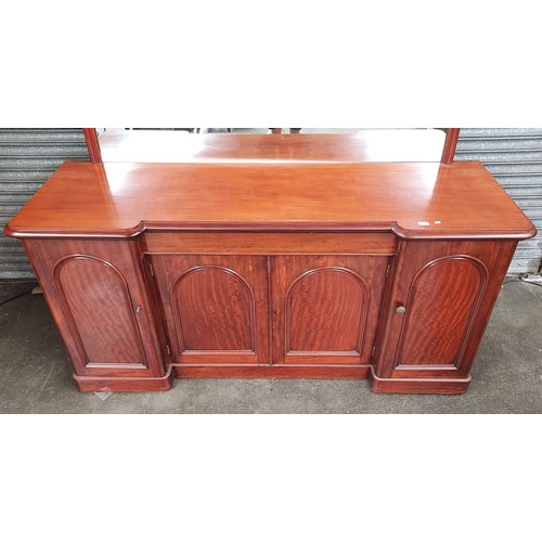 863 - 19th century mahogany sideboard, the mirror with shaped moulded frame above a pull-out narrow centre... 