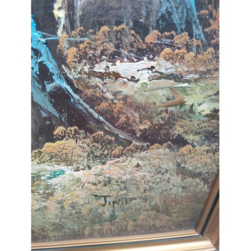 424 - Oil painting depicting river and forest scene signed Jin P fitted in a gilt frame.