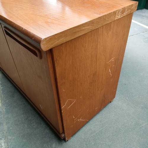 456 - A possible McIntosh of Kirkcaldy mid century teak side board with fitted drawers and cupboards .