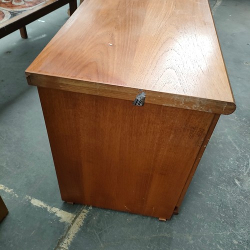 456 - A possible McIntosh of Kirkcaldy mid century teak side board with fitted drawers and cupboards .