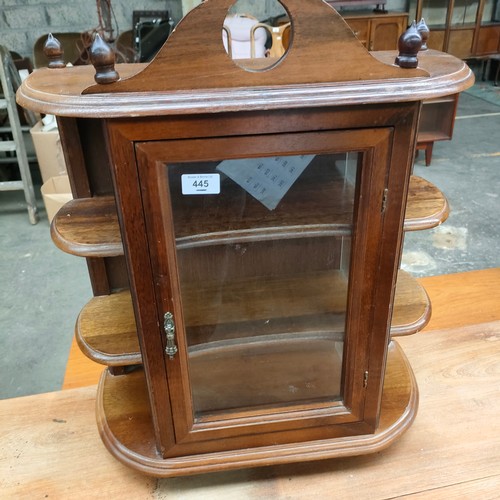 445 - Ornate mahogany wall cabinet .