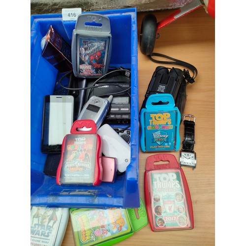 416 - Box of mobile phones , trump cards , watches , sound bar etc.