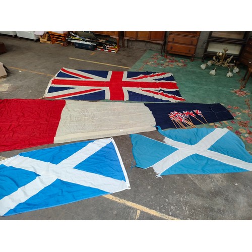 410 - Lot of vintage flags and vintage Britain small flags etc.