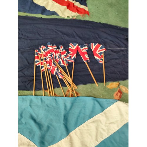 410 - Lot of vintage flags and vintage Britain small flags etc.