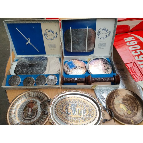 409 - 2 boxed plated coaster part sets , pair of wooden candle sticks together with eastern themed metal p... 