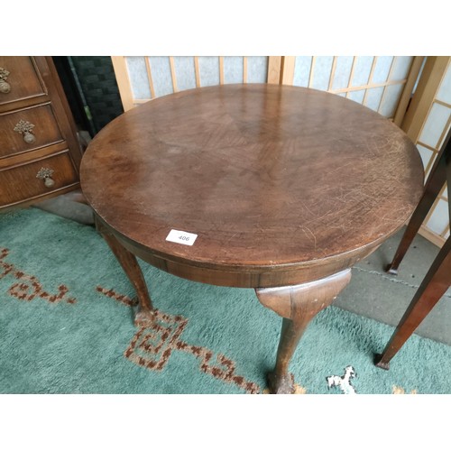 406 - Antique circular table with ball and claw feet .