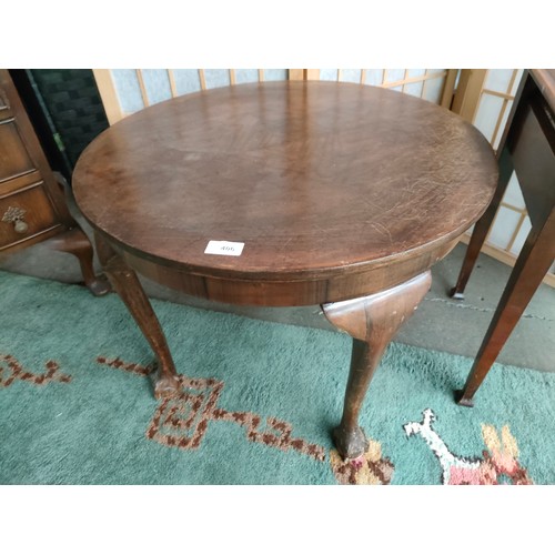 406 - Antique circular table with ball and claw feet .