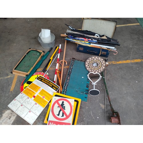 398 - Large lot of miscellaneous to include , hockey sticks , lolly pop sign , vintage score board , pin b... 