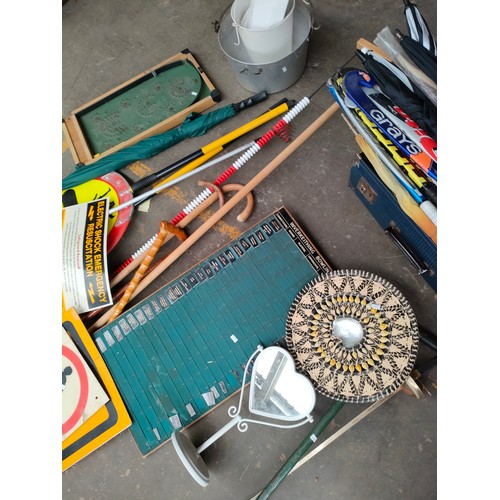 398 - Large lot of miscellaneous to include , hockey sticks , lolly pop sign , vintage score board , pin b... 