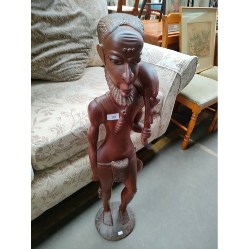 389 - Large solid wood hand carved African man warrior figure over 3ft in height .