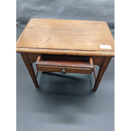 834 - 19th century miniature table, the rectangular top above a single drawer and carved apron, raised on ... 