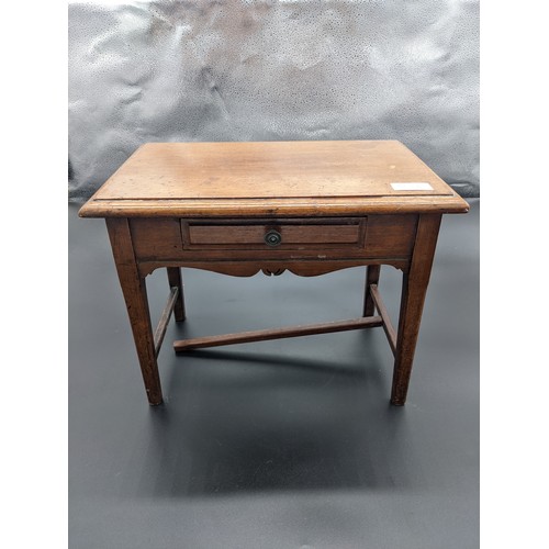 834 - 19th century miniature table, the rectangular top above a single drawer and carved apron, raised on ... 