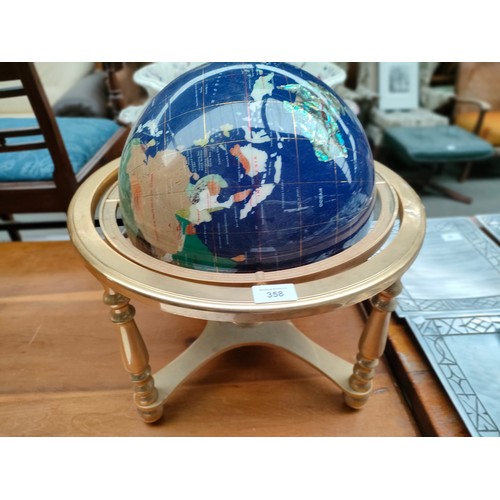 358 - Large semi precious world globe on brass stand .