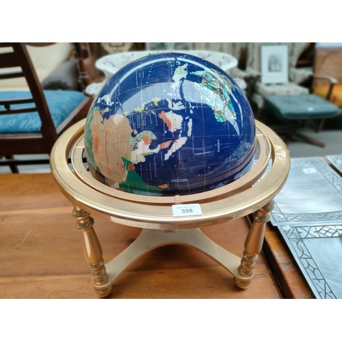 358 - Large semi precious world globe on brass stand .